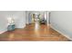 Bright and spacious living room with hardwood floors and views into the open kitchen and dining area at 3020 Heathstead Pl # A, Charlotte, NC 28210