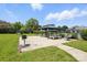 Outdoor space with a gazebo, picnic tables, grill, and lounge chairs near swimming pool at 3020 Heathstead Pl # A, Charlotte, NC 28210