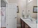 A clean bathroom featuring dark wood cabinets, white countertops, and a shower with curtain at 3020 Waxhaw Crossing Dr, Waxhaw, NC 28173