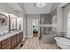 Beautiful primary bathroom featuring dual vanities, a soaking tub, and a glass enclosed shower at 3020 Waxhaw Crossing Dr, Waxhaw, NC 28173