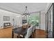Formal dining room with hardwood floors, elegant chandelier, and natural light at 3020 Waxhaw Crossing Dr, Waxhaw, NC 28173