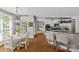 Open concept eat-in kitchen adjoins the breakfast nook that overlooks a sunny dining room at 3020 Waxhaw Crossing Dr, Waxhaw, NC 28173