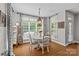 Bright dining room features decorative lighting, neutral walls, and a sunny window at 3020 Waxhaw Crossing Dr, Waxhaw, NC 28173
