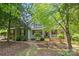 Charming home featuring a covered front porch, neutral siding, and well-manicured landscaping at 3020 Waxhaw Crossing Dr, Waxhaw, NC 28173