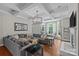 Spacious living room with coffered ceilings, fireplace, and large sectional sofa at 3020 Waxhaw Crossing Dr, Waxhaw, NC 28173