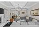 Open-concept living room with a fireplace, built-in shelving, and a large comfortable sectional at 3020 Waxhaw Crossing Dr, Waxhaw, NC 28173