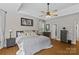 Serene main bedroom featuring hardwood floors, a ceiling fan, ample closet space, and neutral decor at 3020 Waxhaw Crossing Dr, Waxhaw, NC 28173