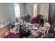 Bedroom with personal items scattered on the floor, a window, a desk and a chair at 32891 Nc 49 Hwy, New London, NC 28127