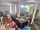 Living Room with hardwood floors, two support columns and personal items scattered on the floor at 32891 Nc 49 Hwy, New London, NC 28127