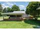 This home features a covered porch and a lovely backyard at 3425 Long Ferry Rd, Salisbury, NC 28146