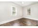 This bedroom features hardwood floors, two windows, and white trim at 3425 Long Ferry Rd, Salisbury, NC 28146