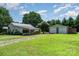 Property featuring a one-story house and a spacious two-car detached garage at 3425 Long Ferry Rd, Salisbury, NC 28146