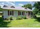 The home's exterior features a metal roof and landscaped yard at 3425 Long Ferry Rd, Salisbury, NC 28146