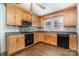 Kitchen featuring wooden cabinets, dark countertops, and stainless steel appliances at 3425 Long Ferry Rd, Salisbury, NC 28146
