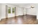 Living room featuring hardwood floors, two windows, and a ceiling fan at 3425 Long Ferry Rd, Salisbury, NC 28146