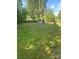 Expansive backyard with ample green space and outbuilding/shed at 3774 Seaman Dr, Charlotte, NC 28217