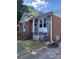 This brick home boasts well-maintained exterior and charming blue shutters, enhancing its traditional appeal at 3774 Seaman Dr, Charlotte, NC 28217