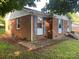 Charming brick home with a well-maintained exterior, accented by tasteful blue shutters at 3774 Seaman Dr, Charlotte, NC 28217
