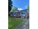 Classic brick home featuring blue shutters and a neatly maintained lawn, providing curb appeal at 3774 Seaman Dr, Charlotte, NC 28217