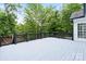 Beautiful wood deck area with black wooden railing and lush, green surroundings at 402 Wildlife Rd, Troutman, NC 28166