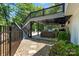 Outdoor patio and backyard featuring a shaded area, outdoor seating, and a built-in grilling area at 402 Wildlife Rd, Troutman, NC 28166