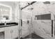 Elegant bathroom featuring a glass-enclosed shower, modern fixtures, and marble accents at 402 Wildlife Rd, Troutman, NC 28166