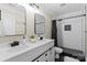 Modern bathroom with subway tile shower, dual vanity, and black hardware at 402 Wildlife Rd, Troutman, NC 28166