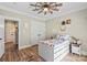 Comfortable bedroom with wood floors, closet and neutral color walls, and a window at 402 Wildlife Rd, Troutman, NC 28166