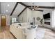 Cozy living area with vaulted ceilings, a stone fireplace, and comfortable seating at 402 Wildlife Rd, Troutman, NC 28166