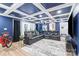Entertainment room featuring comfortable seating, sleek floors, and modern lighting at 402 Wildlife Rd, Troutman, NC 28166