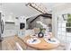 Bright and airy open concept living space with an eat in kitchen and seating area at 402 Wildlife Rd, Troutman, NC 28166