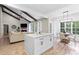 Open concept living space with modern furniture and an attached dining area and fireplace at 402 Wildlife Rd, Troutman, NC 28166
