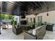 Inviting covered patio area featuring an outdoor kitchen and comfortable seating at 402 Wildlife Rd, Troutman, NC 28166