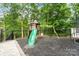 Backyard playground and trampoline offer fun and engaging activities for  at 402 Wildlife Rd, Troutman, NC 28166
