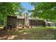 Lush backyard featuring a stone chimney, outdoor patio, and a gazebo for outdoor entertaining at 407 Sweetgum Dr # B, Fort Mill, SC 29715