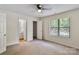 Bright bedroom featuring a ceiling fan, closet, and ensuite bathroom at 407 Sweetgum Dr # B, Fort Mill, SC 29715