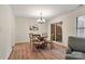 Dining room featuring a wood table with seating for four, chandelier, and access to the patio at 407 Sweetgum Dr # B, Fort Mill, SC 29715