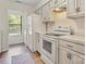 Cozy kitchen featuring white cabinets, modern appliances, and hardwood floors at 407 Sweetgum Dr # B, Fort Mill, SC 29715