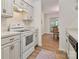 Cozy kitchen with white appliances, matching cabinets, and an adjacent dining area at 407 Sweetgum Dr # B, Fort Mill, SC 29715