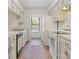 Well-lit kitchen with white cabinets, modern appliances, and ample counter space at 407 Sweetgum Dr # B, Fort Mill, SC 29715