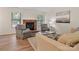 Cozy living room with a brick fireplace, modern decor, and great natural light at 407 Sweetgum Dr # B, Fort Mill, SC 29715