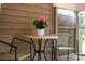 Cozy porch with a charming table, chairs, and potted flowers, perfect for relaxing outdoors at 407 Sweetgum Dr # B, Fort Mill, SC 29715