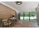 Enclosed wooden porch with a table, chairs, wooden flooring and a view of the outdoors at 407 Sweetgum Dr # B, Fort Mill, SC 29715