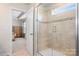 Modern shower with glass door and a peek into the bedroom at 4116 Tory Path Rd, Waxhaw, NC 28173