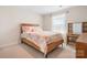 Comfortable bedroom with a bed, desk, and window with natural light at 4116 Tory Path Rd, Waxhaw, NC 28173
