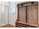Welcoming entryway with a custom-built mudroom bench and storage, enhancing organization and style at 4116 Tory Path Rd, Waxhaw, NC 28173