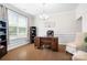 Bright office with hardwood floors, a large window, and a modern desk and chair at 4116 Tory Path Rd, Waxhaw, NC 28173