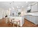 Beautiful kitchen features stainless appliances, granite countertops, gray cabinets, and counter seating at 4116 Tory Path Rd, Waxhaw, NC 28173