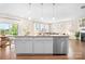 Open concept kitchen with stainless steel dishwasher and ample cabinet space, perfect for entertaining at 4116 Tory Path Rd, Waxhaw, NC 28173