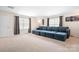 Spacious living room featuring a large sectional sofa and neutral carpeting at 4116 Tory Path Rd, Waxhaw, NC 28173